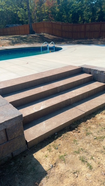 Wide poolside steps and adjacent paving